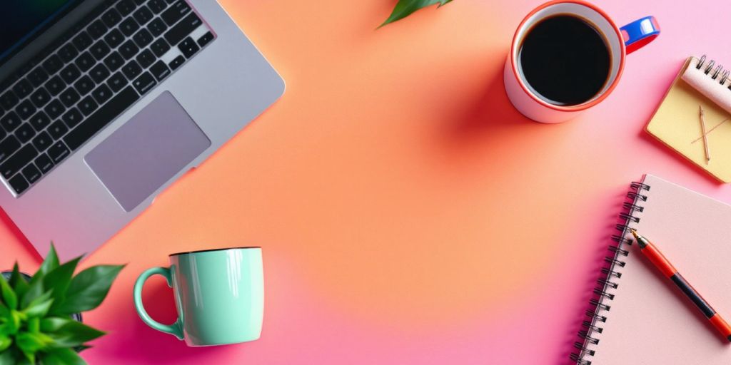 Modern workspace with laptop and coffee cup.