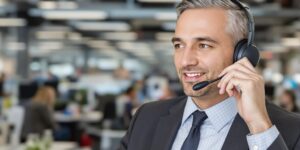 Business professional using a headset in an office.